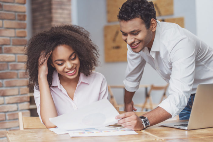 Attractive Afro-American couple working